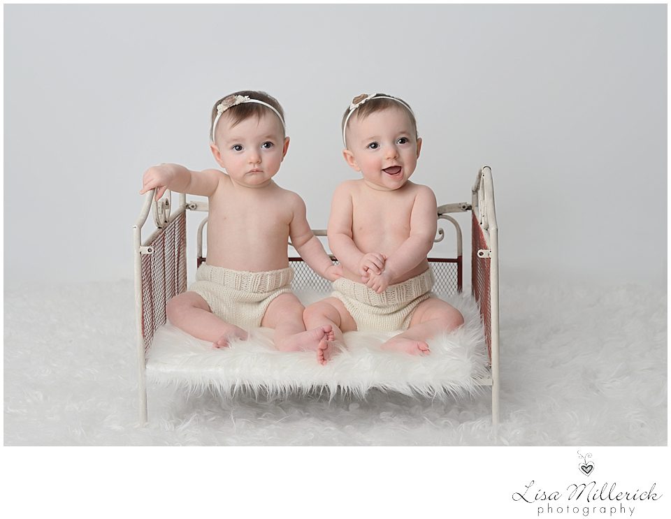 identical twin baby girls sitting
