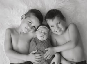 baby sister love newborn black and white hugs photographer