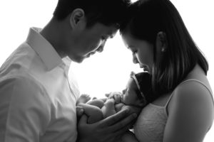 black white newborn photo posed parents