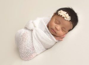 wrapped up white creamy vintage timeless newborn girl photography