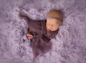baby in purple bows small sweet newborn