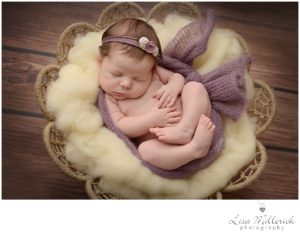newborn baby in purple