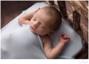 boy baby newborn bed sleepy pose