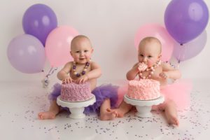 pink purple twins one year cake smash